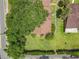 Overhead view of a residential property with mature trees and well-maintained landscaping at 1591 Revere Ln, Daytona Beach, FL 32117