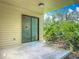 Back porch with view of lush landscaping at 1591 Revere Ln, Daytona Beach, FL 32117