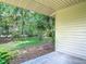 Back porch with tropical landscaping at 1591 Revere Ln, Daytona Beach, FL 32117