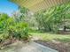 Back porch overlooking beautiful landscaping at 1591 Revere Ln, Daytona Beach, FL 32117