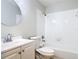 Clean bathroom featuring a vanity with sink, toilet, and a tub with shower at 1591 Revere Ln, Daytona Beach, FL 32117