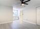 Bedroom with new hardwood floors, ceiling fan and bathroom access at 1591 Revere Ln, Daytona Beach, FL 32117