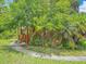 Landscaped front yard with lush greenery and a brick exterior, creating a welcoming curb appeal at 1591 Revere Ln, Daytona Beach, FL 32117