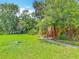 Well-maintained front yard with healthy green grass and a cozy, shaded entrance at 1591 Revere Ln, Daytona Beach, FL 32117