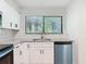 Updated kitchen featuring stainless steel appliances, granite countertops, and ample cabinet space at 1591 Revere Ln, Daytona Beach, FL 32117