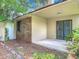 Outdoor patio with sliding glass doors offers a peaceful retreat with the privacy of trees, shrubs and landscaping at 1591 Revere Ln, Daytona Beach, FL 32117