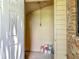 View of storage area with a door, showing ample space and storage shelving at 1591 Revere Ln, Daytona Beach, FL 32117