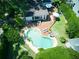 Aerial view highlighting a backyard oasis with a custom pool, large deck, and lush landscaping at 1791 Spruce Ave, Winter Park, FL 32789
