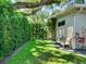 A serene backyard featuring lush greenery, mature trees and a swing providing a peaceful outdoor retreat at 1791 Spruce Ave, Winter Park, FL 32789