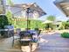 Inviting outdoor space features a grill, dining area and a covered seating section, perfect for entertainment and relaxation at 1791 Spruce Ave, Winter Park, FL 32789