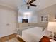 Bright bedroom with shuttered window, ceiling fan and hardwood floors at 1791 Spruce Ave, Winter Park, FL 32789
