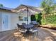 Outdoor patio includes a seating area with a grill, large umbrella and a wood deck, providing a perfect space to unwind at 1791 Spruce Ave, Winter Park, FL 32789