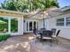 Inviting backyard deck features comfortable seating, a large umbrella, and ample space for outdoor dining and entertaining at 1791 Spruce Ave, Winter Park, FL 32789