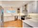 Modern kitchen featuring white cabinets, stainless steel appliances, and ample counter space at 1791 Spruce Ave, Winter Park, FL 32789