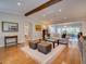 Bright and airy living room featuring hardwood floors, exposed beam, and an open floor plan at 1791 Spruce Ave, Winter Park, FL 32789