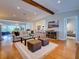 Spacious living room featuring hardwood floors, neutral colors, and an open layout with eat-in kitchen at 1791 Spruce Ave, Winter Park, FL 32789