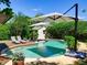 Inviting backyard pool with lounge chairs and umbrellas perfect for relaxing and enjoying the outdoors at 1791 Spruce Ave, Winter Park, FL 32789