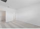 Bright bedroom featuring neutral carpet, a walk-in closet, and white paint at 2026 Firethorn Loop, Haines City, FL 33844