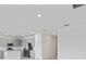 Bright living space featuring recessed lighting that flows into a modern kitchen at 2026 Firethorn Loop, Haines City, FL 33844