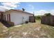 Exterior view of the home with fencing in the backyard and a AC unit at 2041 Swanson Dr, Deltona, FL 32738