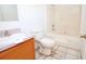 Standard bathroom with a toilet, sink, mirror and shower with a tub at 2041 Swanson Dr, Deltona, FL 32738