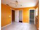 Bedroom with tile flooring and multiple doorways for easy access to other rooms at 2041 Swanson Dr, Deltona, FL 32738