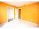 Spacious bedroom featuring tile flooring, natural light, and closet space at 2041 Swanson Dr, Deltona, FL 32738