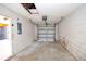 Spacious garage with ample storage, concrete floor, and a functional garage door at 2041 Swanson Dr, Deltona, FL 32738