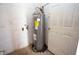 Utility area showcasing the water heater, with water supply lines and connections at 2041 Swanson Dr, Deltona, FL 32738