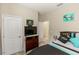 Bedroom featuring stylish bedding, dark curtains, neutral walls, and a TV at 20723 Macon Pkwy, Orlando, FL 32833