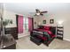 Spacious bedroom with a ceiling fan, a large bed, and stylish decor creating a relaxing atmosphere at 20723 Macon Pkwy, Orlando, FL 32833