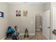 Neutral bedroom space with exercise equipment and doorway to hallway at 20723 Macon Pkwy, Orlando, FL 32833