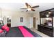 Spacious main bedroom with a ceiling fan, dresser, and view into the en-suite bathroom at 20723 Macon Pkwy, Orlando, FL 32833