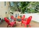 Outdoor patio setting with firepit and multiple chairs for entertaining in a charming backyard at 2223 Amherst Ave, Orlando, FL 32804