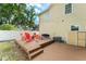 A cozy backyard patio with steps, ample seating, BBQ and string lights creating a welcoming outdoor space at 2223 Amherst Ave, Orlando, FL 32804