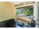 Private balcony with outdoor seating and views of surrounding trees at 2223 Amherst Ave, Orlando, FL 32804