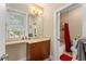 Bathroom featuring a vanity with natural stone countertop and a combined tub and shower at 2223 Amherst Ave, Orlando, FL 32804