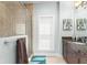 Cozy bathroom featuring a glass shower with a view and granite countertops at 2223 Amherst Ave, Orlando, FL 32804