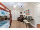 Bedroom with a bunk bed, vaulted ceilings, ceiling fan, carpeted floor, and recliner at 2223 Amherst Ave, Orlando, FL 32804