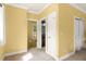 Bedroom featuring neutral carpet, bright yellow walls, and white trim work at 2223 Amherst Ave, Orlando, FL 32804