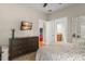 Bedroom with modern furnishings, TV, soft carpet and access to ensuite bathroom at 2223 Amherst Ave, Orlando, FL 32804