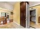 Entryway showing the dining area and laundry room with a large pantry, tile and hardwood floors at 2223 Amherst Ave, Orlando, FL 32804