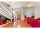 Warm entryway featuring hardwood floors, a staircase, and a bright, inviting atmosphere at 2223 Amherst Ave, Orlando, FL 32804