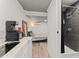 A stylish interior featuring a kitchenette, bedroom area, and a sleek bathroom to enhance the functionality at 2223 Amherst Ave, Orlando, FL 32804