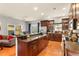 Modern kitchen with granite counters, hardwood floors, and seamless flow to living and dining areas at 2223 Amherst Ave, Orlando, FL 32804