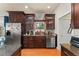 Kitchen features stainless steel appliances, ample counter space, and hardwood flooring at 2223 Amherst Ave, Orlando, FL 32804