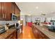 Modern kitchen with stainless steel appliances and granite countertops, flowing into the living area at 2223 Amherst Ave, Orlando, FL 32804