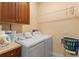Bright laundry room equipped with a washer and dryer, providing convenience at 2223 Amherst Ave, Orlando, FL 32804