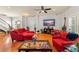 Spacious open-concept living room with hardwood floors, modern decor, and bright natural light at 2223 Amherst Ave, Orlando, FL 32804