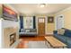 Cozy living room with hardwood floors, a fireplace, and comfortable seating at 2223 Amherst Ave, Orlando, FL 32804